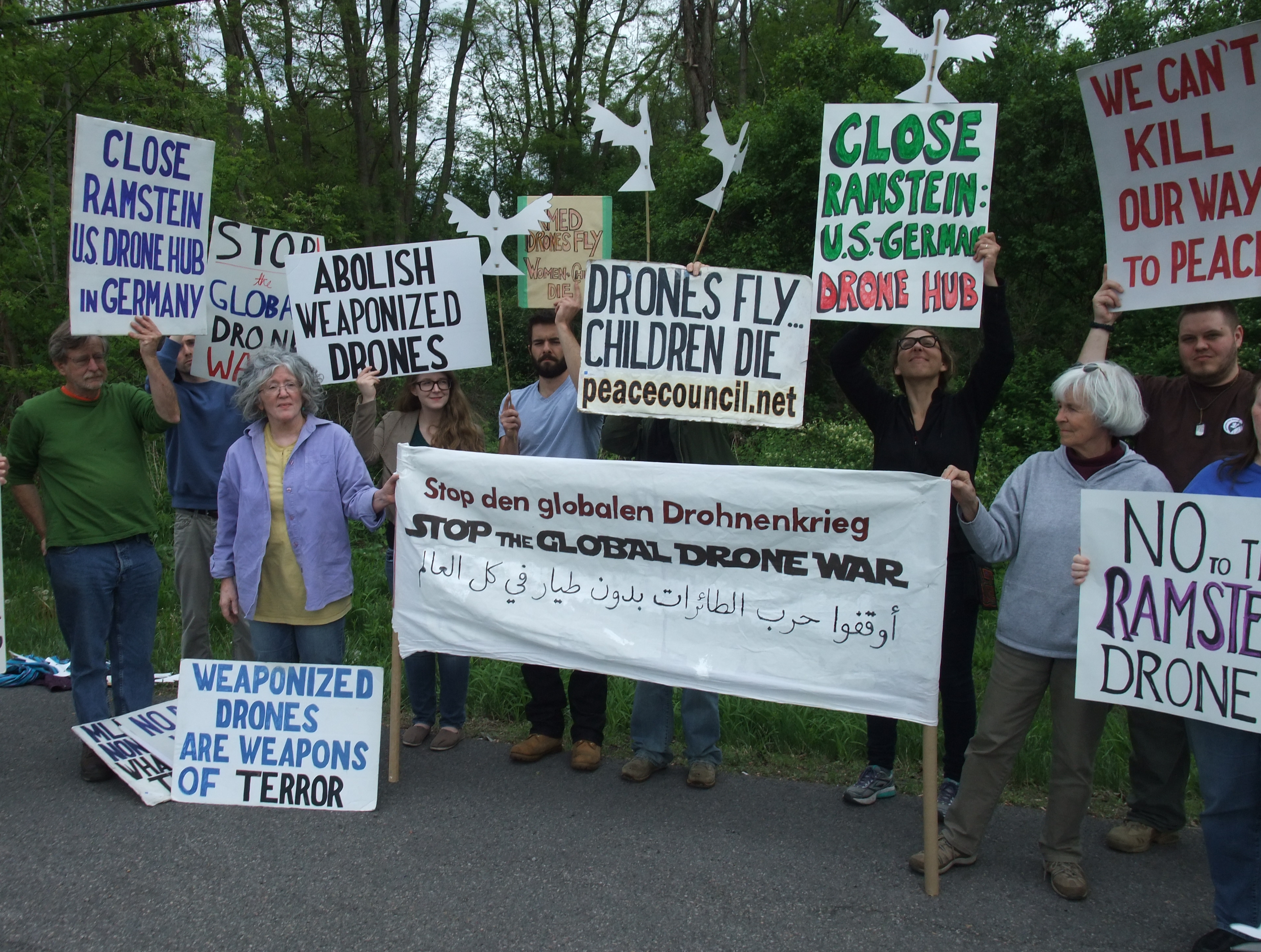SPC activists demonstrate outside of Hancock Airbase on May 21