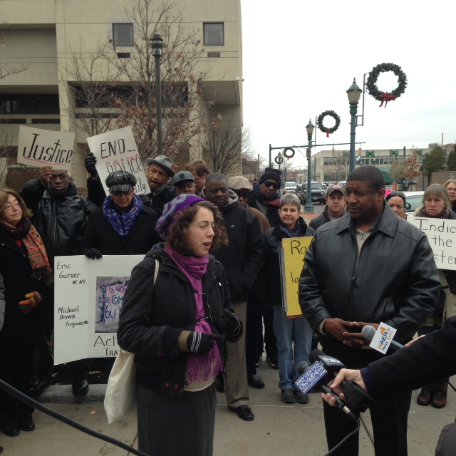 Syracuse Peace Council Amelia Lefevre speaking at news conference in 2014.