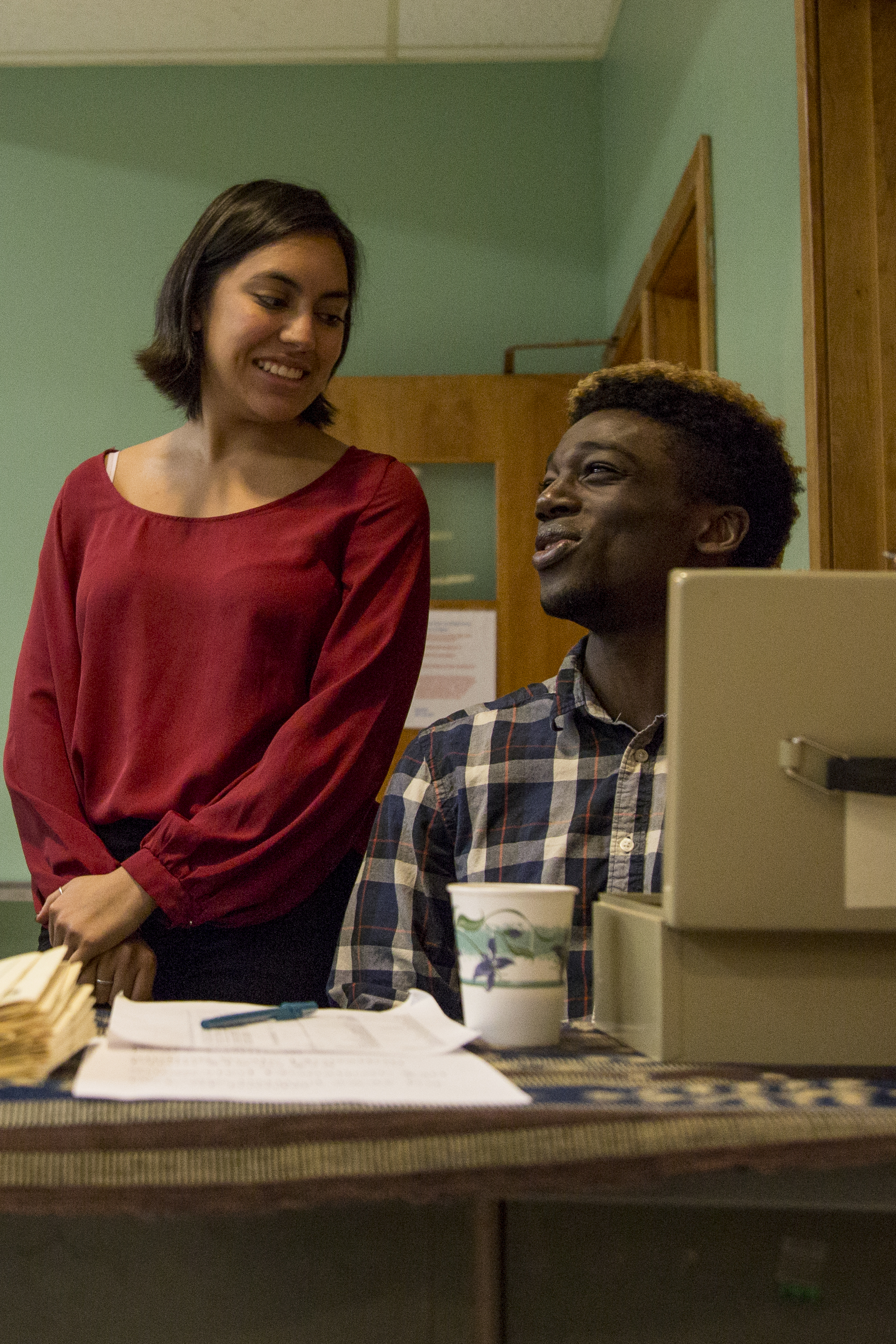 SPC interns Xochitl Santamaria and Marlon Calliste staff the door at SPC's birth